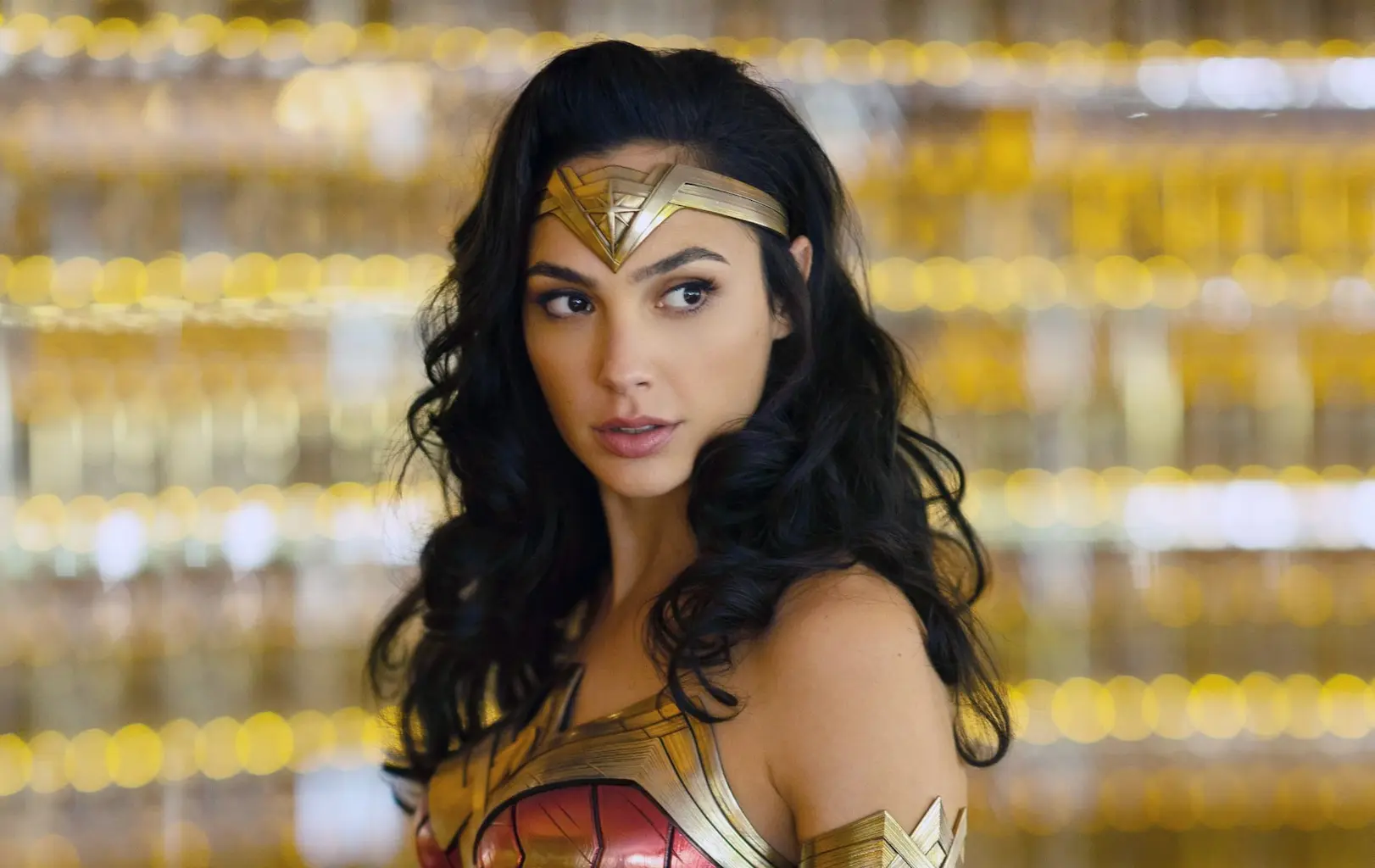 Original photo of a woman in a superhero costume against a golden backdrop